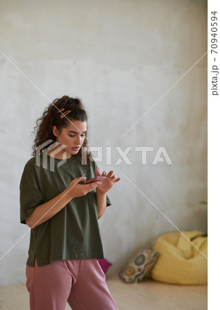 Dancer using her phone Dancer using her phone 70940594