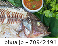 yummy salt-crusted grilled fish in dish 70942491