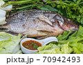 yummy salt-crusted grilled fish in dish 70942493