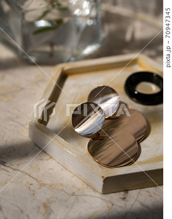 Jewelry earrings in storage tray close-up shot 70947345