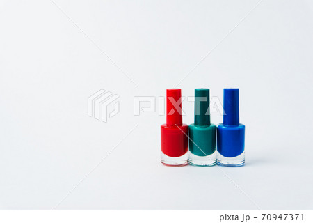 colored nail polishes on a white background 70947371