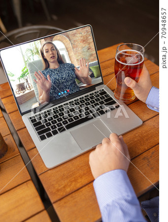 Remote working, online entertainment during quarantine. Remote events in bar, restaurant office with PC, devices and gadgets. 70948657