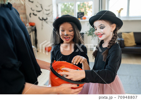 Trick-or-treating tradition on Halloween 70948807