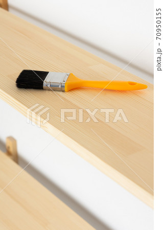 Paint brush on a wooden shelf Paint brush on a wooden shelf 70950155
