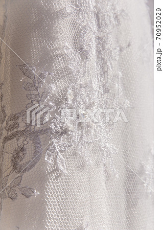 Details of the bride dress fabric and beautiful embroidery wedding concept used as a background for illustrations 70952029