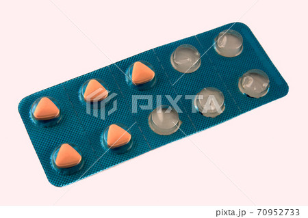 A blister with pills and empty spots.Fifty fifty used blister A blister with pills and empty spots.Fifty fifty used blister 70952733