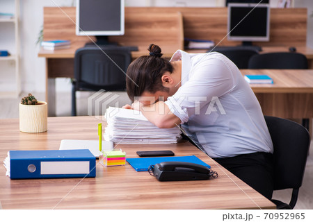 Young male employee working in the office Young male employee working in the office 70952965