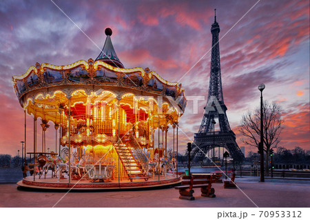sunset over vintage carousel close to Eiffel Tower, Paris 70953312