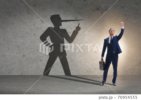 Concept of businessman liar with his shadow Concept of businessman liar with his shadow 70954555
