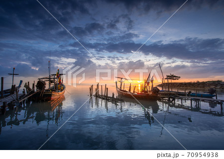 Beautiful beach with fisherman boat during sunrise on fisherman village. Beautiful beach with fisherman boat during sunrise on fisherman village. 70954938