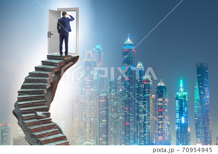 Concept of career ladder and door with businessman 70954945