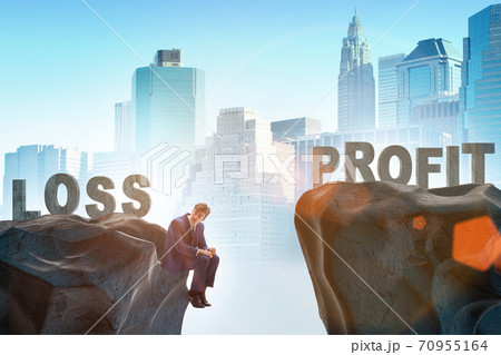Concept of going from loss to profit with businessman 70955164