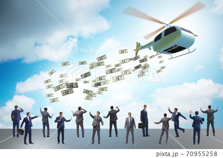 Businessman in helicopter money concept Businessman in helicopter money concept 70955258