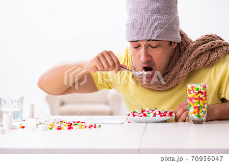 Young man suffering at home Young man suffering at home 70956047