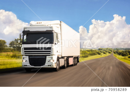 White truck moving on a road 70958289