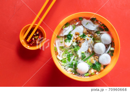 Overhead view of simple Chinese fishball noodle soup served in bowl 70960668