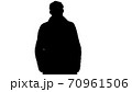 Silhouette Smiling man in coat is looking at camera and walking. 70961506