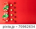 Christmas background, Christmas box with red ribbon and green ribbon, red ball and gold star on red background. Christmas background and Happy New Year for background 70962634