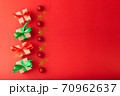 Christmas background, Christmas box with red ribbon and green ribbon, red ball and gold star on red background. Christmas background and Happy New Year for background 70962637