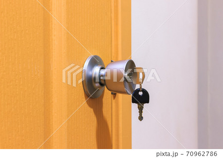 Key in keyhole on door Key in keyhole on door 70962786