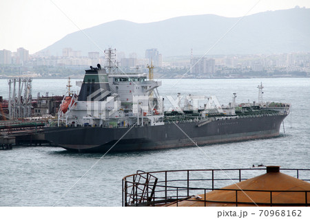 Large cargo ship docked in the port Large cargo ship docked in the port 70968162