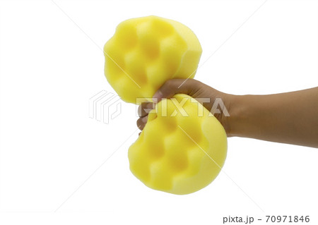 Woman hand holding cleaning yellow sponge isolated on white background. Woman hand holding cleaning yellow sponge isolated on white background. 70971846