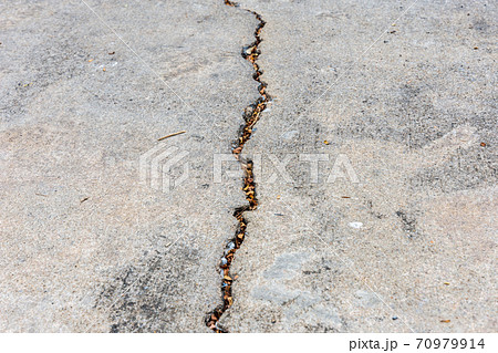 cracked concrete road 70979914
