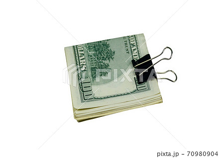 Bundle of bills of american one hundred dollars in paper clip isolated on white background 70980904