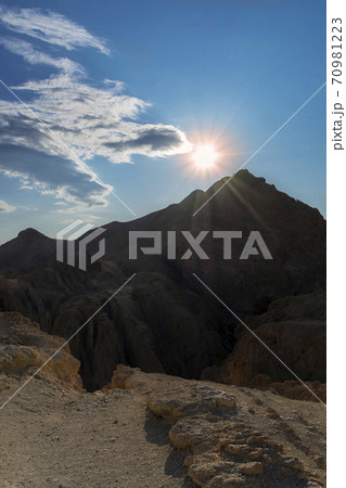 morning sun, rays of light over a mountain peak in the Atlas mountains 70981223