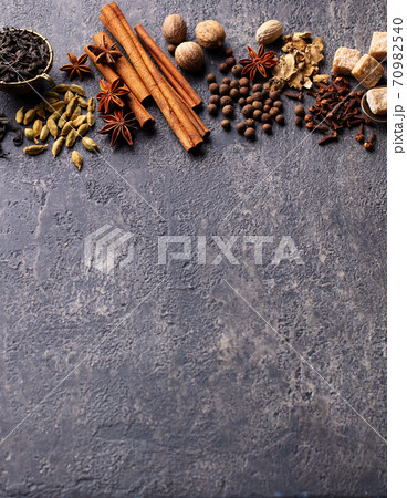 Spices for Indian masala tea. Grey background. Copy space. Spices for Indian masala tea. Grey background. Copy space. 70982540