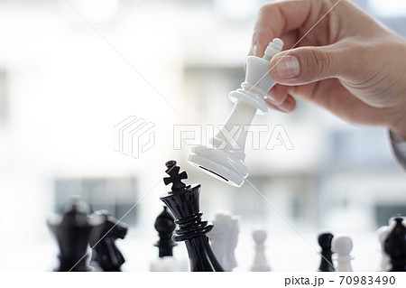 Business men make plans to play chess with Prudence and success, Management or leadership concept. Business men make plans to play chess with Prudence and success, Management or leadership concept. 70983490