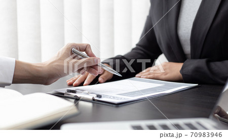 HR head is reading the resume and information about the candidate's history, Field employers are interviewing job applicants and negotiating agreements, Recruitment and job applications concept. 70983946