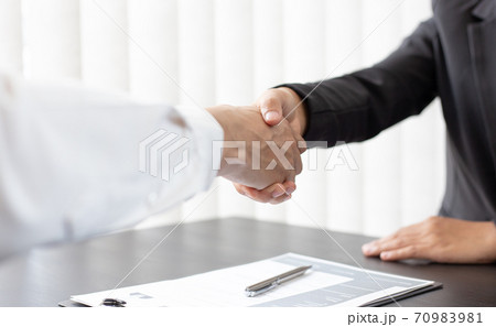 Close-up of Head of Human Resources and new employees Shake hands to congratulate them on their collaboration, Successful job interviews and the willingness to work together concept. 70983981