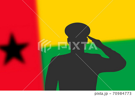 Solder silhouette on blur background with Guinea-Bissau flag. Solder silhouette on blur background with Guinea-Bissau flag. 70984773