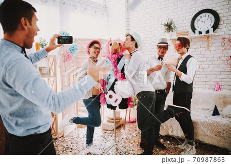 Young guys have fun at a gay party. Young guys have fun at a gay party. 70987863