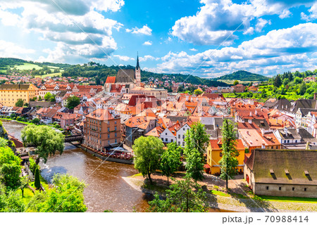 Panoramic view of Cesky Krumlov with St Vitus church in the middle of historical city centre. Cesky Krumlov, Southern Bohemia, Czech Republic Panoramic view of Cesky Krumlov with St Vitus church in the middle of historical city centre. Cesky Krumlov, Southern Bohemia, Czech Republic 70988414