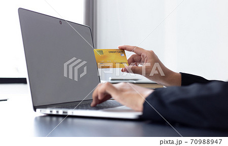 women use laptop to register online purchases using credit card payments, Convenience in the world of technology and the internet, Shopping online and banking online concept. women use laptop to register online purchases using credit card payments, Convenience in the world of technology and the internet, Shopping online and banking online concept. 70988947