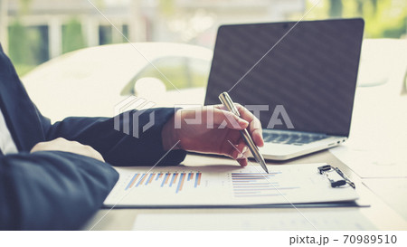 Accounting businessmen are calculating income-expenditure and analyzing real estate investment data, Dedicated to the progress and growth of the company, Financial and tax systems concept. 70989510
