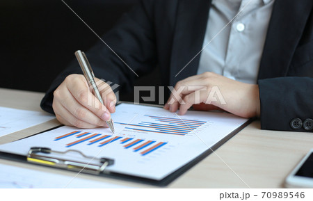 Accounting businessmen are calculating income-expenditure and analyzing real estate investment data, Dedicated to the progress and growth of the company, Financial and tax systems concept. 70989546