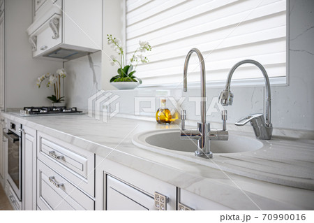 Luxury modern classic white kitchen interior Luxury modern classic white kitchen interior 70990016