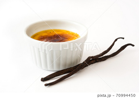 Traditional French creme brulee dessert with caramelized sugar on top isolated on white background Traditional French creme brulee dessert with caramelized sugar on top isolated on white background 70994450