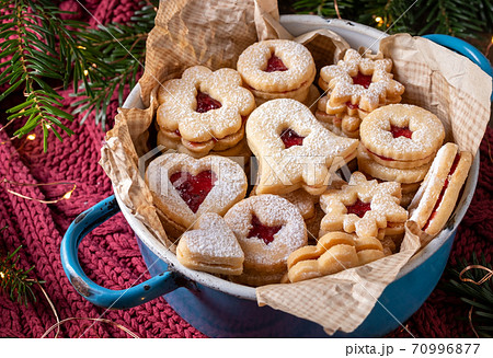 Linzer Christmas cookies filled with red marmalade Linzer Christmas cookies filled with red marmalade 70996877