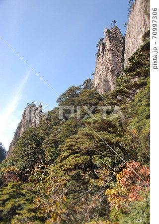Huangshan Mountain in Anhui Province, China. Scenic view of mountain peaks, cliffs and trees in the West Sea or Xi Hai canyon on Huangshan. From the West Sea path on Huangshan Mountain, China. 70997306