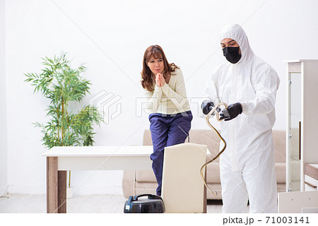 Young male contractor exterminating snakes in the flat Young male contractor exterminating snakes in the flat 71003141