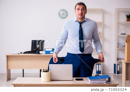 Young male accountant in financial crisis concept 71003324
