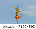 Public lighting poles adorned with statues of young women wearing ancient cultural costumes. Looks in a graceful dance. 71004593
