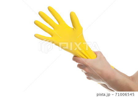 hand in yellow latex Glove For Cleaning isolated on white background. hand in yellow latex Glove For Cleaning isolated on white background. 71006545