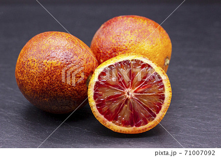 Full and two half of blood red oranges isolated on Full and two half of blood red oranges isolated on 71007092