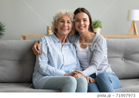 Happy affectionate two generation women grandmother and granddaughter portrait 71007973