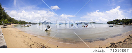 Tropical beach panorama with LongTail boats in the sea blue sky and white clouds in summer season. 71016897